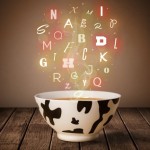 Colorful letters coming out of home cook soup bowl